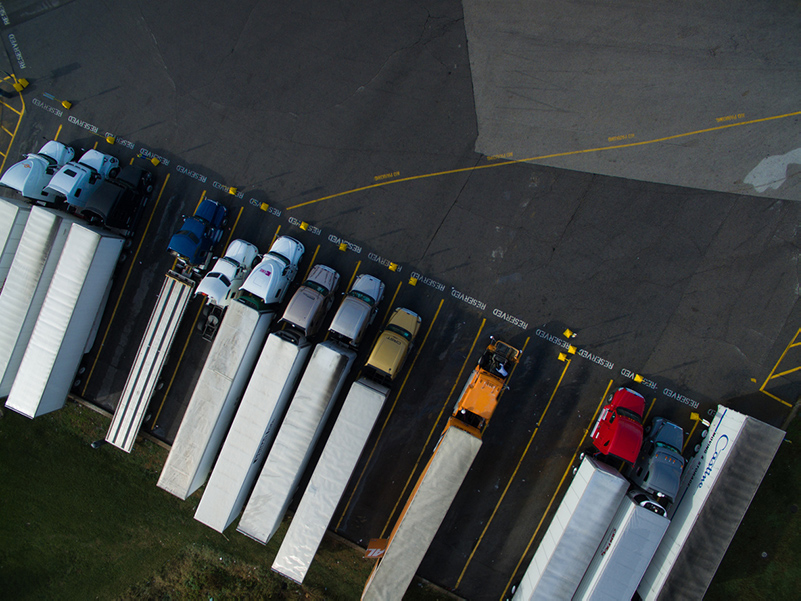 Trucks in reserved parking spots at a truck stop
