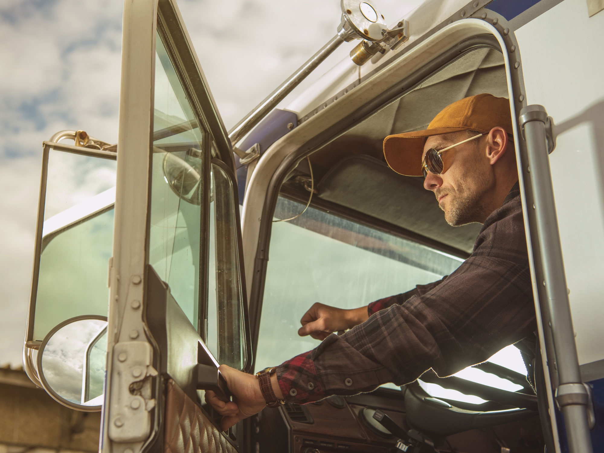 Truck driver getting out of cab